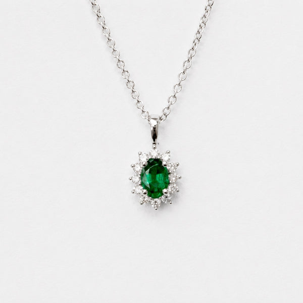 Oval Emerald pendant with Diamond Halo in White Gold