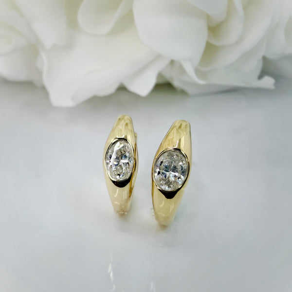 1.00 Total Carat Weight Bezel Set Oval Cut Lab Grown Diamond Huggie Hoops | 10K Yellow Gold