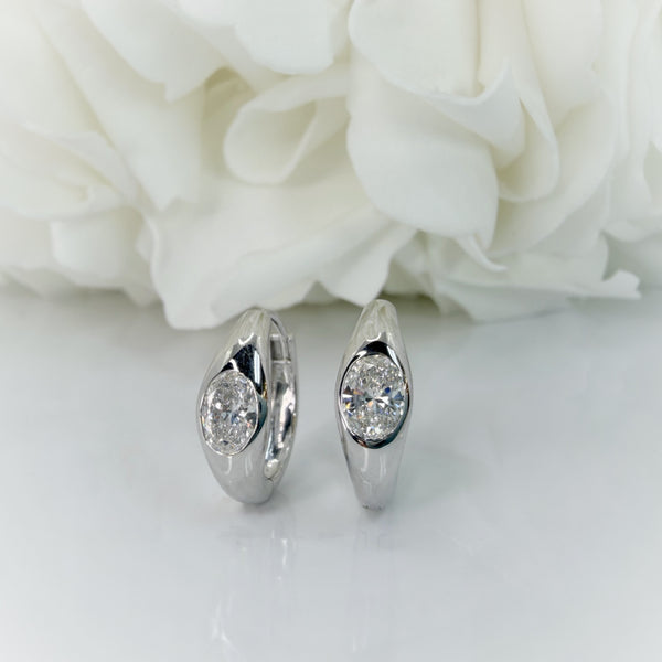 1.00 Total Carat Weight Bezel Set Oval Cut Lab Grown Diamond Huggie Earrings | 10K White Gold
